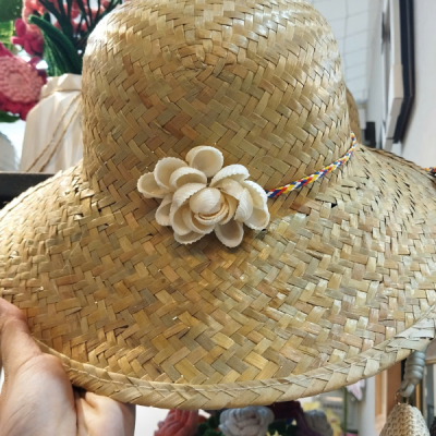 Sedge grass hat with seashell embellishments
