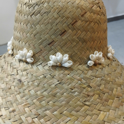 Sedge grass hat with seashell embellishments